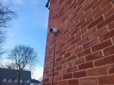 Professional CCTV camera installed on exterior wall